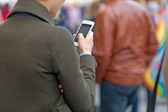 Woman communicating with her mobile phone