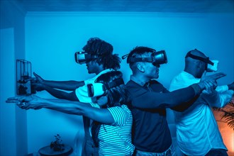 Group of young people with vr glasses in a virtual reality game in a blue light