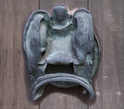 Left bronze fitting on the door of the Tugendbrunnenpotrtal
