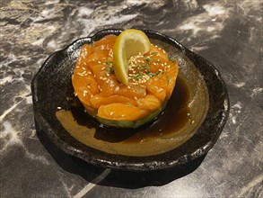 Salmon tartare on avocado