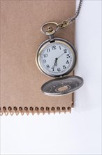 Retro style pocket watch on white background