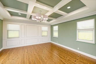 Beautiful light green custom master bedroom complete with entire wainscoting wall