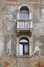 House facades with frescoes on the market square of Trento