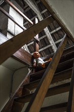 Attic with doll on stairs