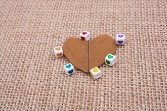 Colorful cubes with a heart on leaf on canvas