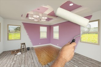 Before and after of man using A paint roller to reveal newly remodeled room with fresh lilac paint