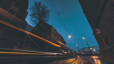 City street at night with vehicle light trails