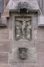 Relief depiction of a crucifixion scene with dove grille at the Lorenzkirche