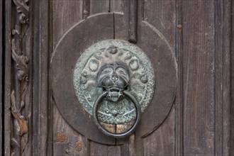 Door knocker with lions head on a door of the Lorenzkirche