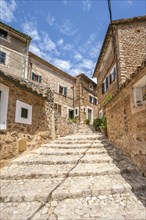 Alley with typical stone houses and stairs