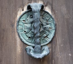 Right bronze fitting on the door of the Tugendbrunnenpotrtal