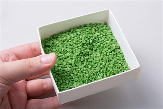Little green color sand in box as a background texture
