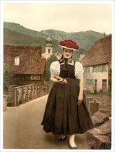 Woman from the Black Forest with traditional traditional costume and Bollen hat