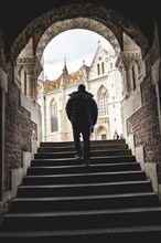 A man arriving at the Fishermans Bastion at the heart of Budas Castle District in Budapest