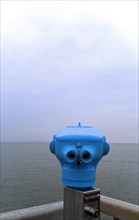 Telescope for tourists in Burhave at the North Sea