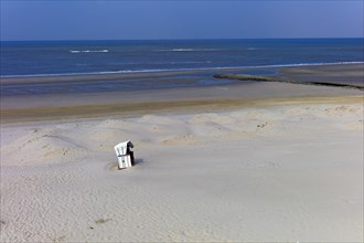 Lonely beach chair on the beach of the island of Wangerooge