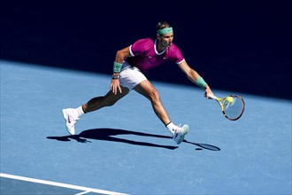 Spanish tennis player Rafael Nadal during the forehand stroke at the Australian Open 2022 Tournament at Melbourne Park