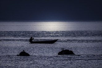 A fisherman in the sunset off the coast of masoala national park in north-eastern Madagascar