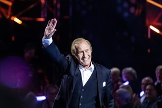 Singer Michael Holm performing on stage. 50 years of ZDF Hitparade