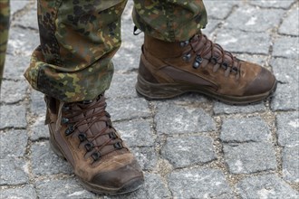 Soldier with camouflage suit and combat boots on the sidelines of the handover roll call of the German Field Army in Nymphenburg Palace