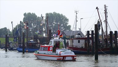 DGzRS rescue boat in the harbour basin of Fedderwardersiel Wesermarsch district Germany Europe