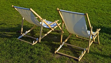 Two deckchairs on a lawn