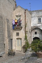 Laundry drying from balcony in the Sassi di Matera complex of cave dwellings in the ancient town of Matera
