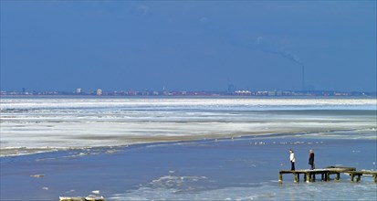 View over the frozen Jade Bay towards Wilhelmshaven