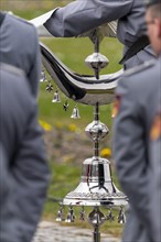 A soldier of the Gebirgsmusikkorpss from Garmisch-Partenkirchen holds the bell tree during the handover roll call of the German Field Army in Nymphenburg Palace