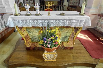 Main altar with candles and floral decorations