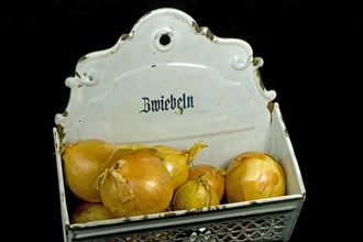Onions in a metal onion box
