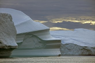 Icebergs at sunset in the Kangia icefjord