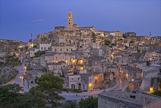 View over the Sassi di Matera complex of cave dwellings at night in the ancient town of Matera