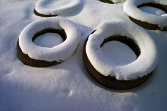 Covering silage with old car tyres in winter