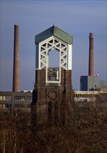 Former church tower of the parish of St. Marien next to chimneys of the heating plant Essen-Innenstadt