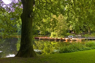 Empty rowing boats on a lake in Buergerpark Bremen