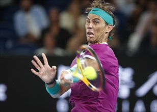 Spanish tennis player Rafael Nadal during the forehand stroke at the Australian Open 2022 Tournament at Melbourne Park