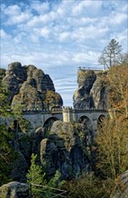 View from the rock castle Neurathen to the Bastei bridge and the new Bastei view