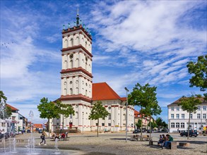 Lively scene in front of the town church on the historic market square of Neustrelitz
