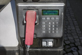 Payphone in the pedestrian zone main street
