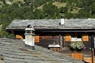 Roof made of natural stone slabs on a Swiss chalet