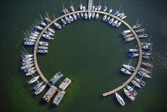 Aerial view over sailing boats docked in the Burgtiefe marina at on Fehmarn