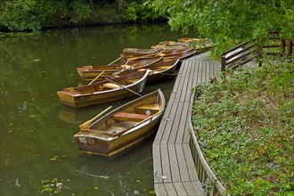 Empty rowing boats on a lake in Buergerpark Bremen