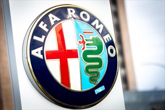 The sign of an Alfa Romeo dealer in a business park in Berlin