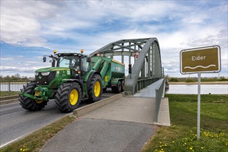 Tractor crossing the Eider bridge Friedrichstadt