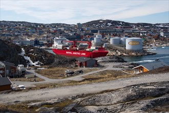 A cargo ship leaves the port of Ilulissat