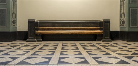 Wooden bench in retro style in the vestibule of Spandau Town Hall
