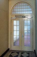 Door with glass panes in an official building