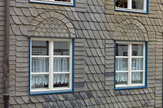 A house facade clad with slate tiles