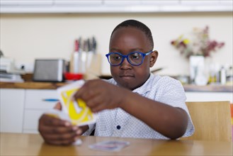 Boy with playing cards